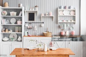 Contemporary kitchen featuring stylish open shelving by NuView Construction