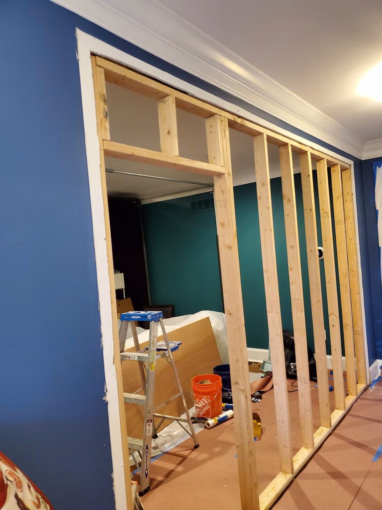 A combination of a display shelf and an opening, allowing you to see through the wall between decor items.