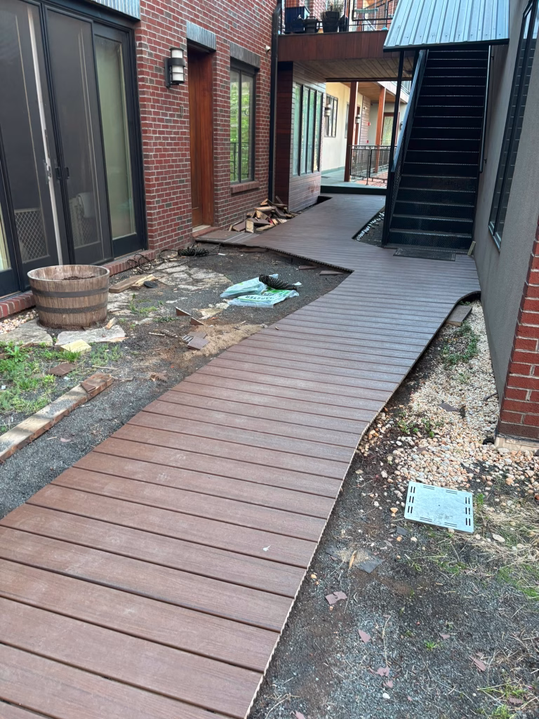 Floating Timber Walkway Connecting Home to Patio